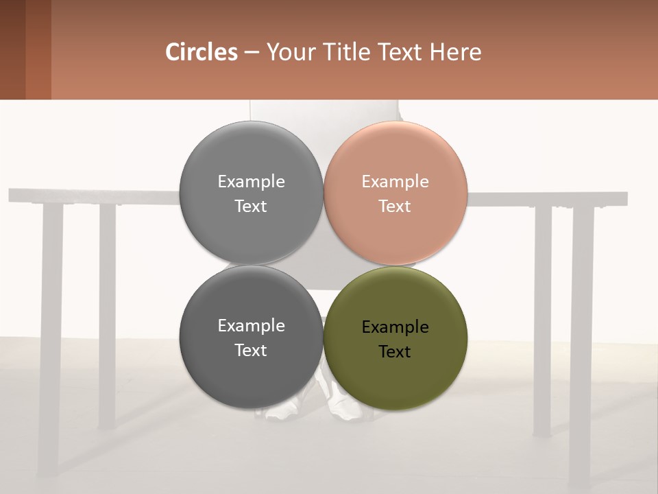 A Man Sitting At A Table Using A Laptop Computer PowerPoint Template