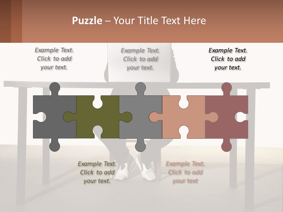 A Man Sitting At A Table Using A Laptop Computer PowerPoint Template