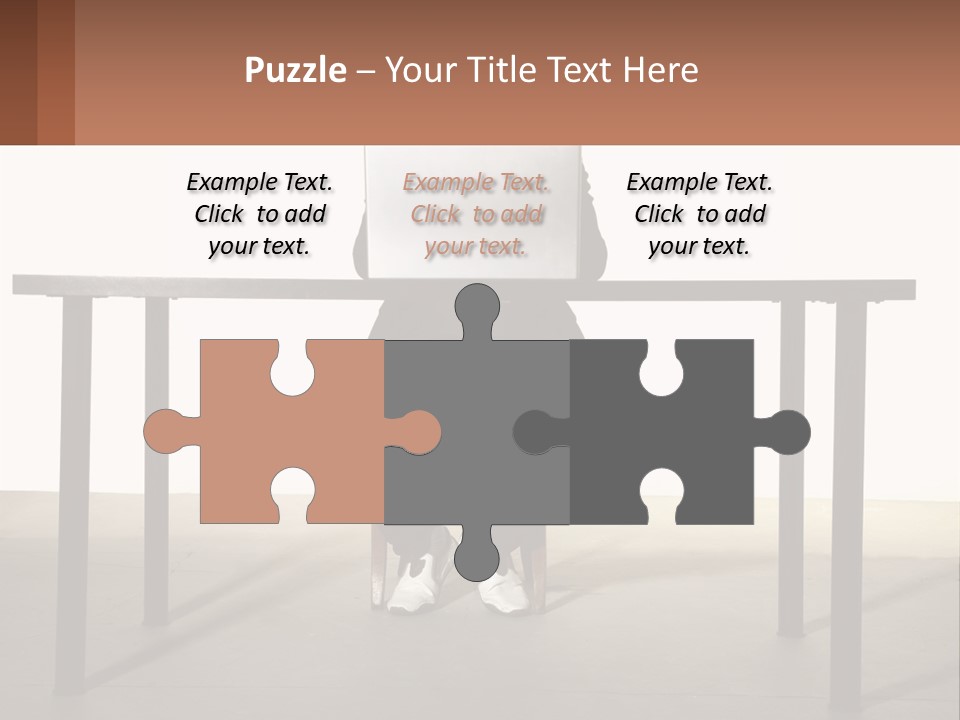 A Man Sitting At A Table Using A Laptop Computer PowerPoint Template