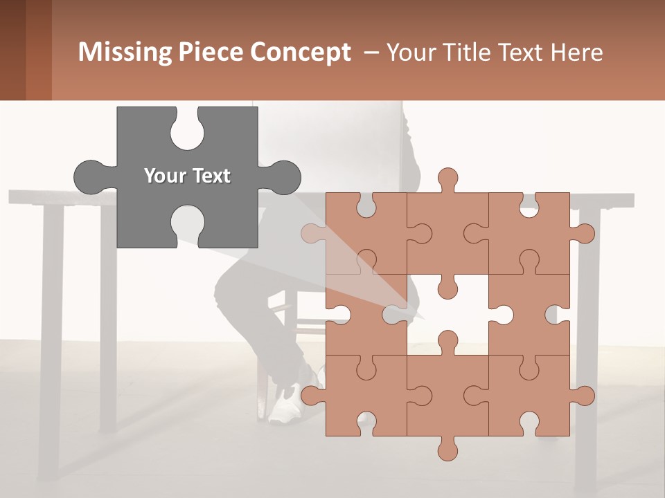 A Man Sitting At A Table Using A Laptop Computer PowerPoint Template