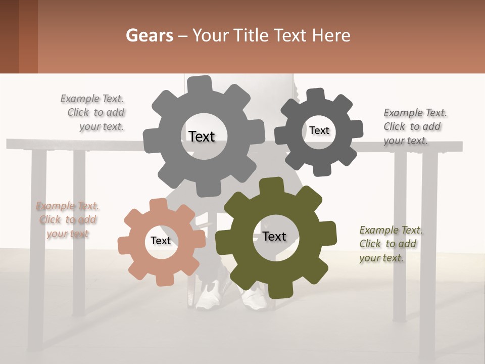 A Man Sitting At A Table Using A Laptop Computer PowerPoint Template