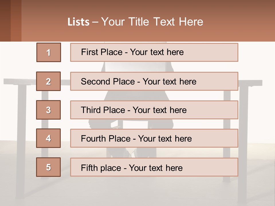 A Man Sitting At A Table Using A Laptop Computer PowerPoint Template