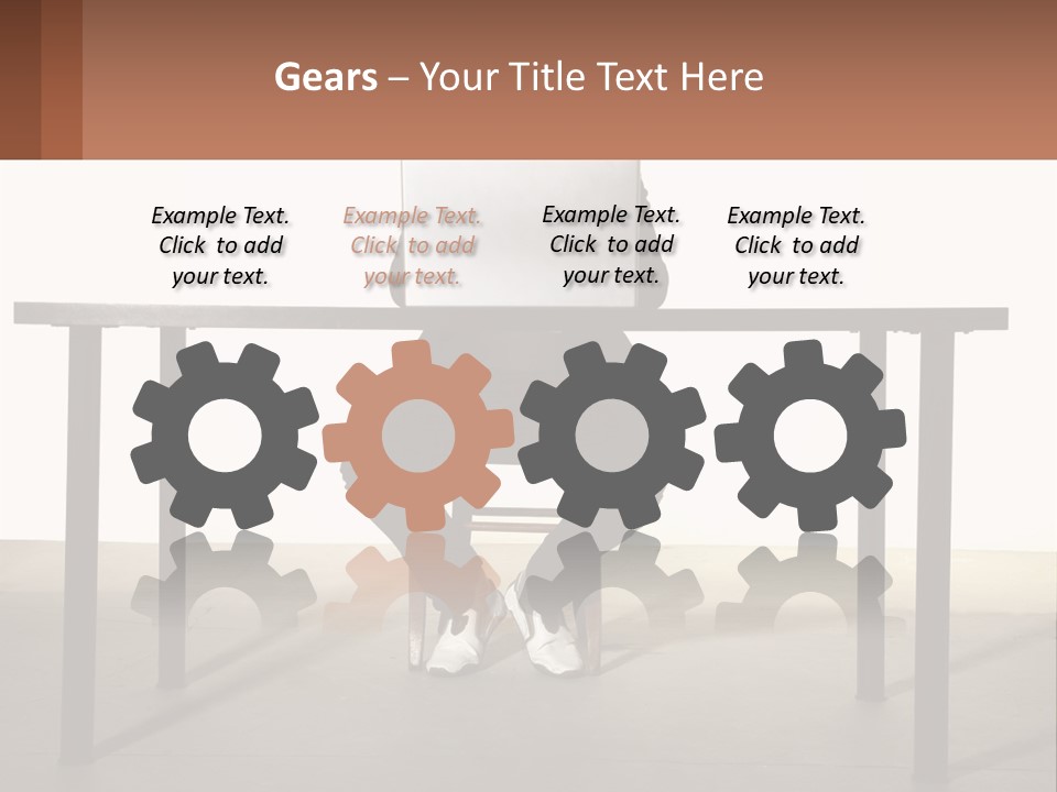 A Man Sitting At A Table Using A Laptop Computer PowerPoint Template