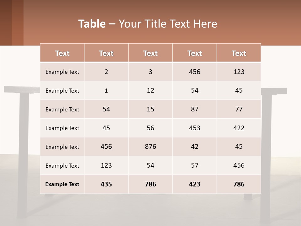 A Man Sitting At A Table Using A Laptop Computer PowerPoint Template