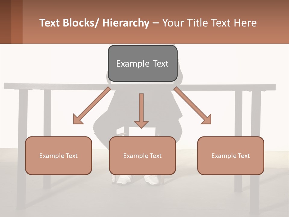 A Man Sitting At A Table Using A Laptop Computer PowerPoint Template