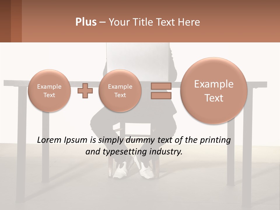 A Man Sitting At A Table Using A Laptop Computer PowerPoint Template