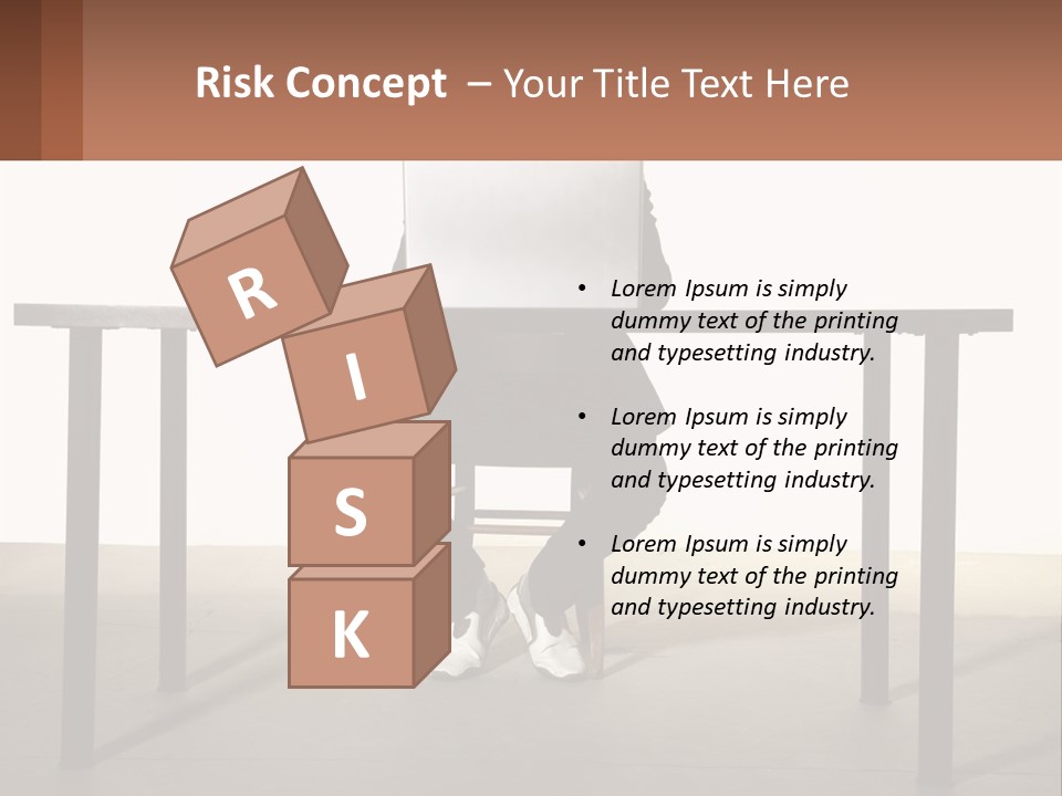 A Man Sitting At A Table Using A Laptop Computer PowerPoint Template