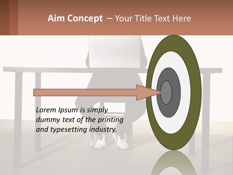 A Man Sitting At A Table Using A Laptop Computer PowerPoint Template