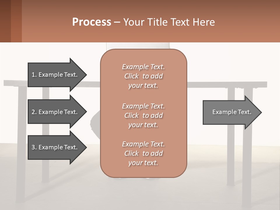 A Man Sitting At A Table Using A Laptop Computer PowerPoint Template