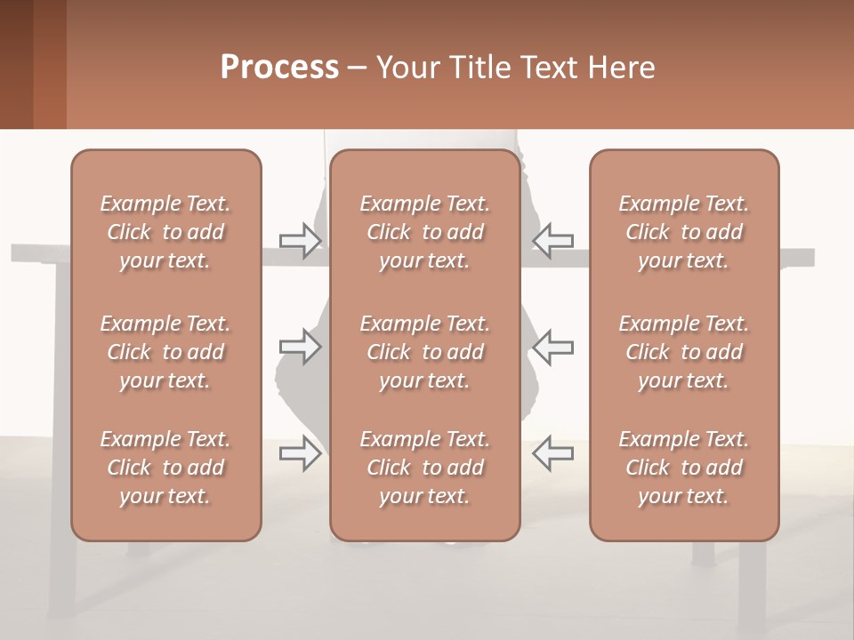 A Man Sitting At A Table Using A Laptop Computer PowerPoint Template