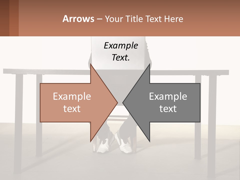 A Man Sitting At A Table Using A Laptop Computer PowerPoint Template