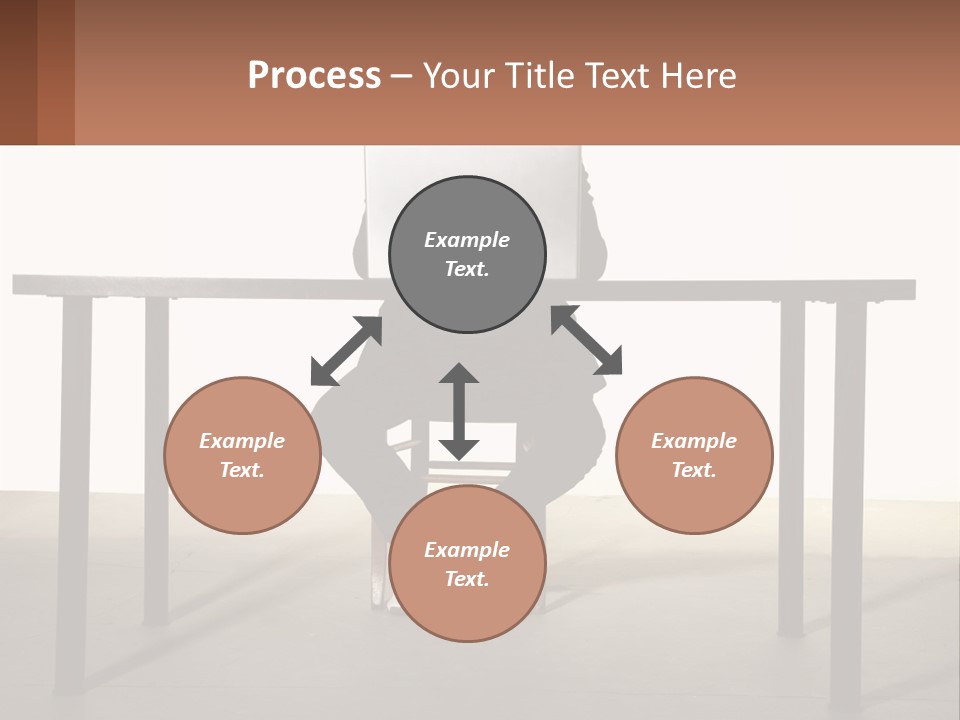A Man Sitting At A Table Using A Laptop Computer PowerPoint Template