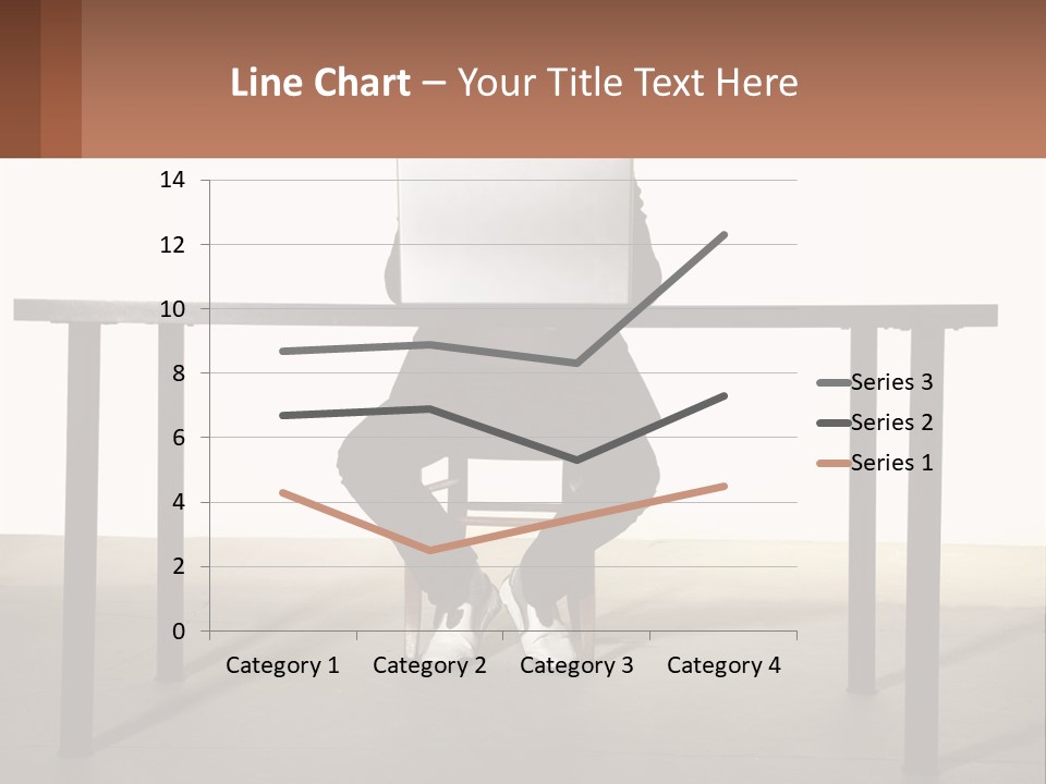 A Man Sitting At A Table Using A Laptop Computer PowerPoint Template