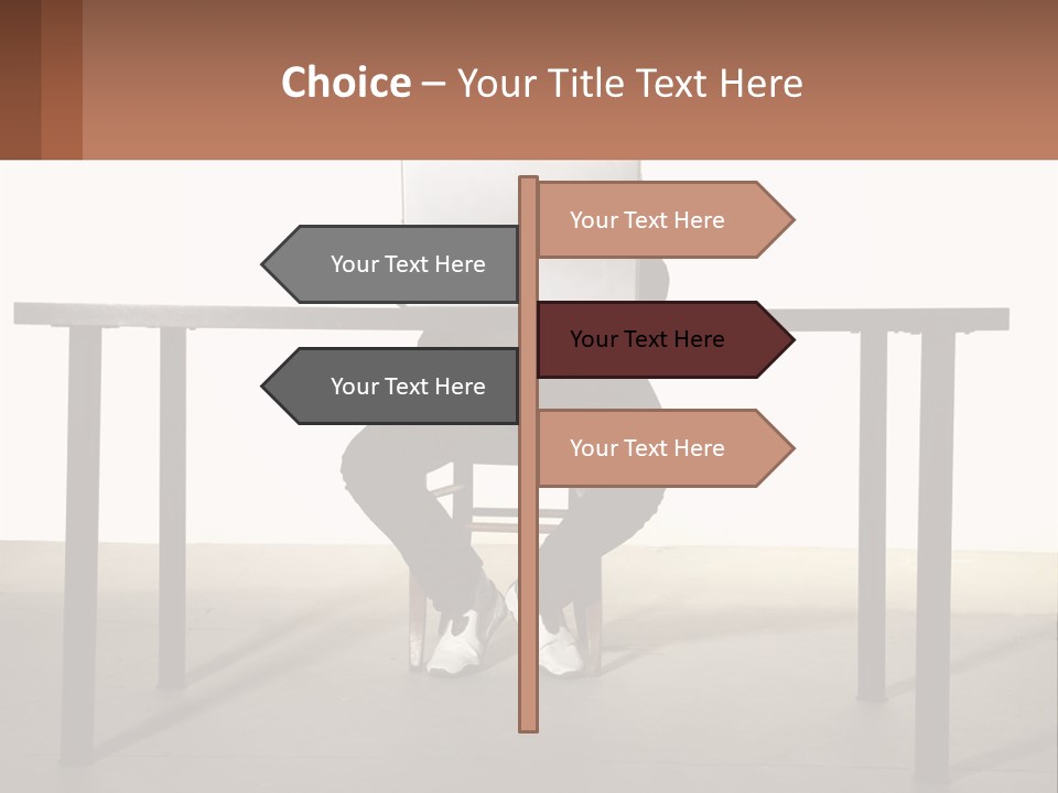 A Man Sitting At A Table Using A Laptop Computer PowerPoint Template