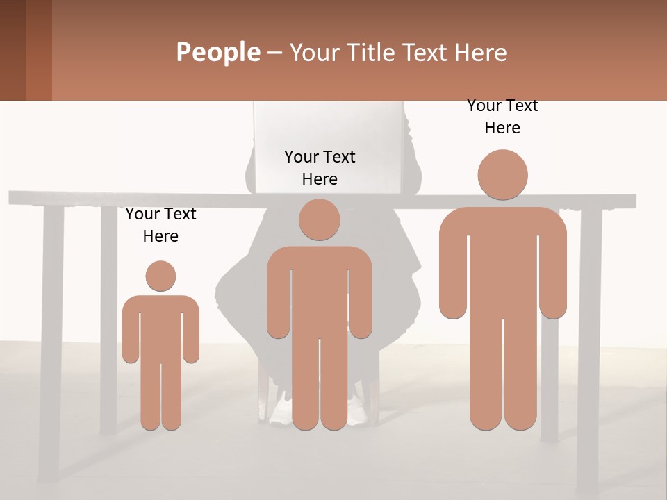 A Man Sitting At A Table Using A Laptop Computer PowerPoint Template
