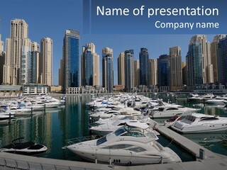 A Group Of Boats Are Docked In A Harbor PowerPoint Template