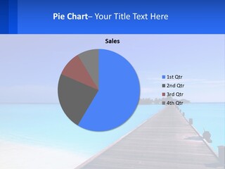 A Pier Leading Into The Ocean With A Boat In The Distance PowerPoint Template
