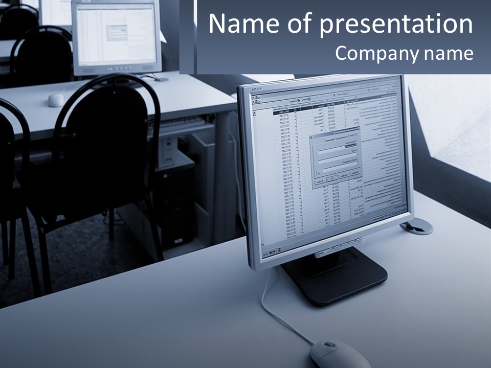 A Computer Monitor Sitting On Top Of A Desk PowerPoint Template