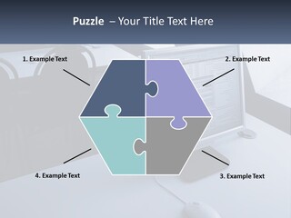 A Computer Monitor Sitting On Top Of A Desk PowerPoint Template