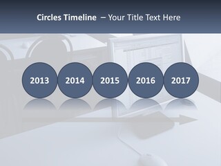 A Computer Monitor Sitting On Top Of A Desk PowerPoint Template