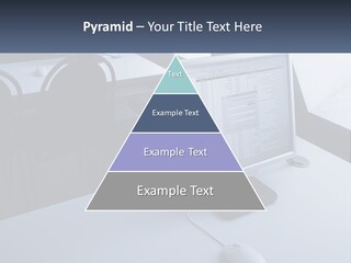 A Computer Monitor Sitting On Top Of A Desk PowerPoint Template
