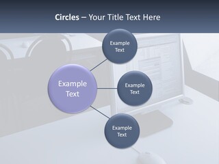 A Computer Monitor Sitting On Top Of A Desk PowerPoint Template