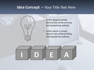 A Computer Monitor Sitting On Top Of A Desk PowerPoint Template