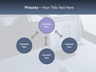 A Computer Monitor Sitting On Top Of A Desk PowerPoint Template