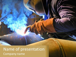 A Welder Working On A Piece Of Metal PowerPoint Template