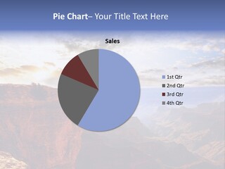 A Person Sitting On Top Of A Cliff Overlooking A Canyon PowerPoint Template