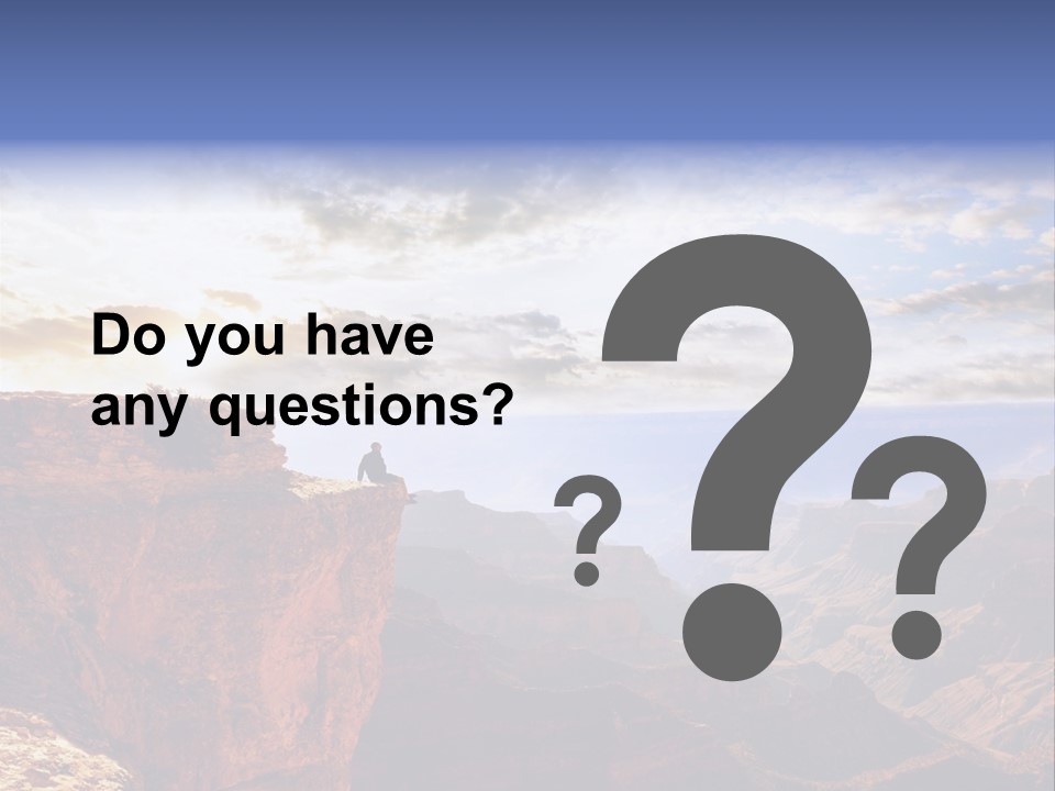 A Person Sitting On Top Of A Cliff Overlooking A Canyon PowerPoint Template