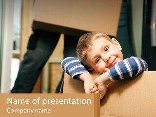 A Young Boy Sitting On Top Of A Cardboard Box PowerPoint Template