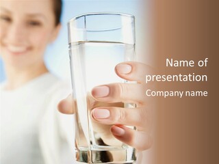 A Woman Holding A Glass Of Water In Her Hand PowerPoint Template