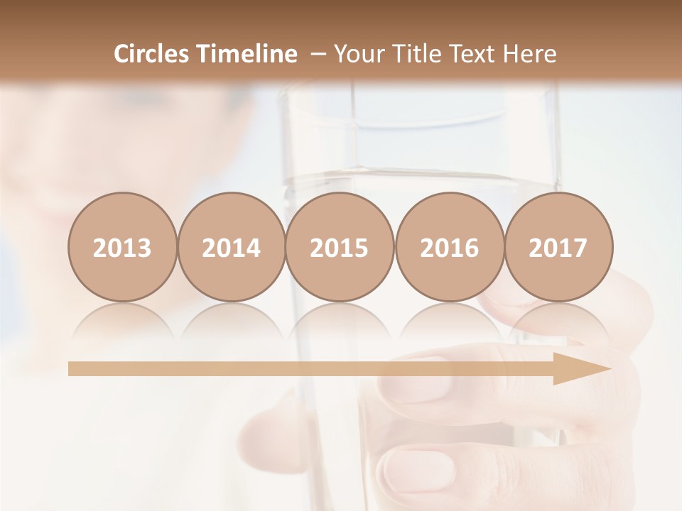 A Woman Holding A Glass Of Water In Her Hand PowerPoint Template