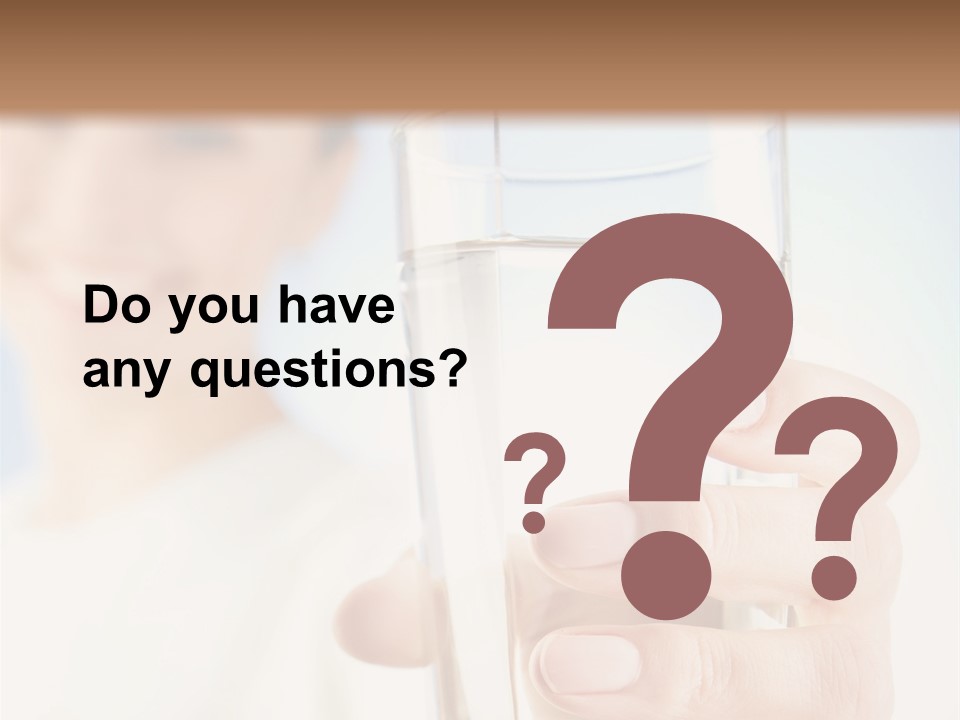 A Woman Holding A Glass Of Water In Her Hand PowerPoint Template