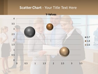 A Group Of Business People Looking At A Piece Of Paper PowerPoint Template