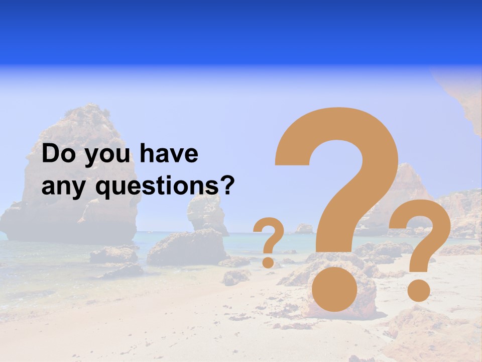 A Rocky Beach With A Rock Formation In The Background PowerPoint Template