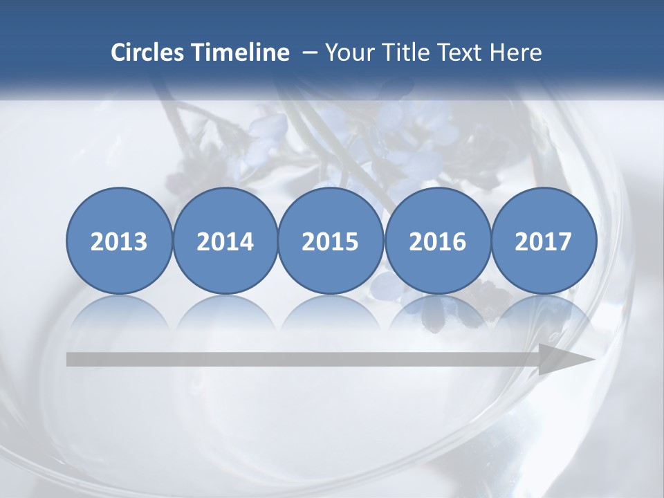 A Glass Vase Filled With Blue Flowers On Top Of A Table PowerPoint Template