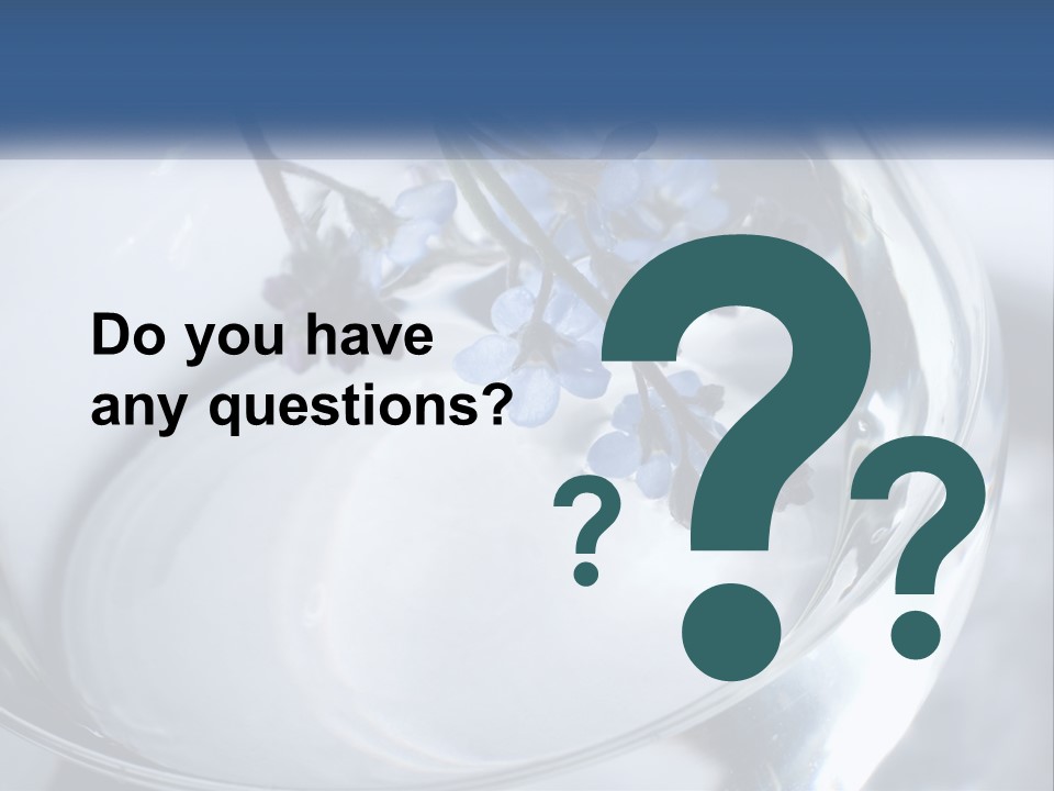 A Glass Vase Filled With Blue Flowers On Top Of A Table PowerPoint Template