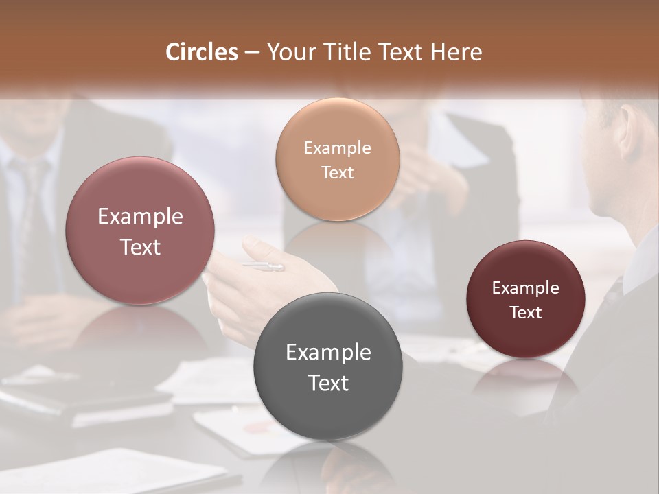 A Group Of Business People Sitting Around A Table PowerPoint Template