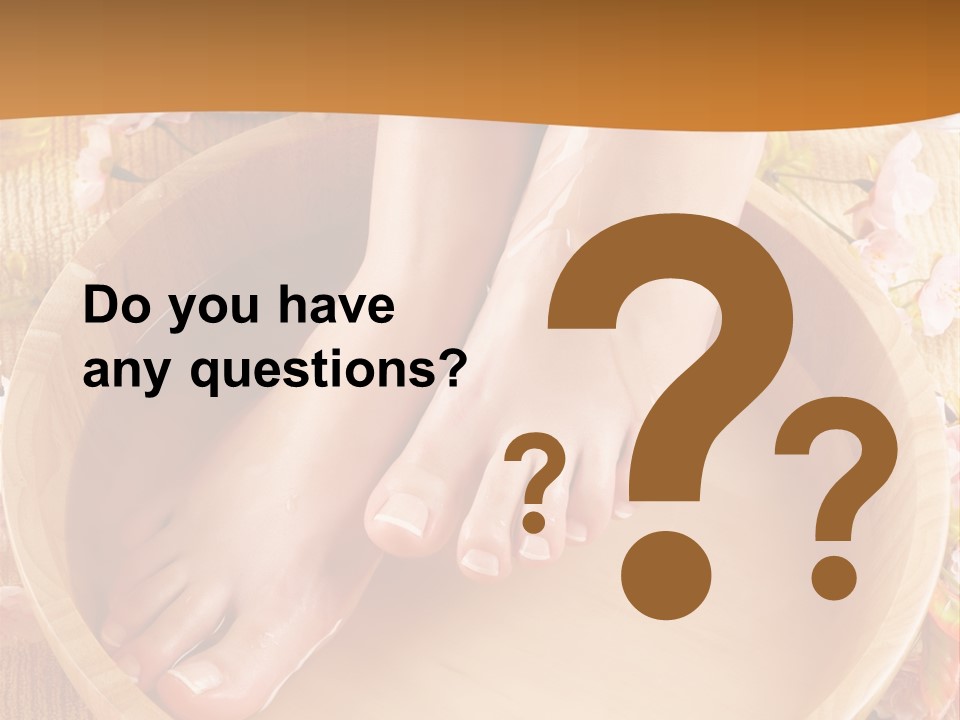 A Woman's Feet On A Wooden Bowl With Flowers PowerPoint Template