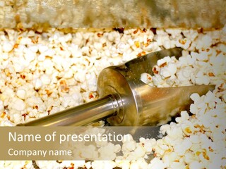 A Popcorn Machine With A Scoop Full Of Popcorn PowerPoint Template