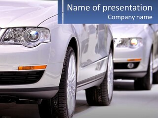 A Row Of White Cars In A Showroom PowerPoint Template
