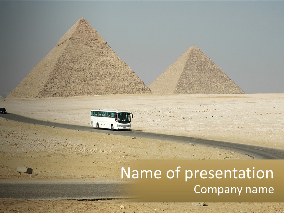 A Bus Driving Down A Road In Front Of Three Pyramids PowerPoint Template
