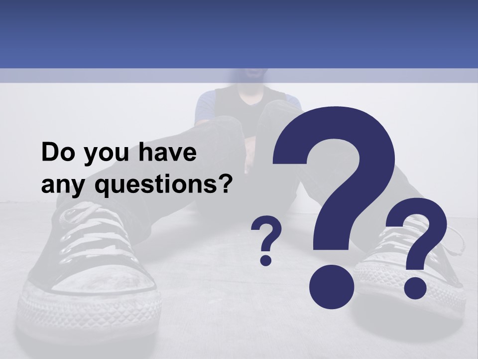 A Man Sitting On The Floor With His Feet Up PowerPoint Template