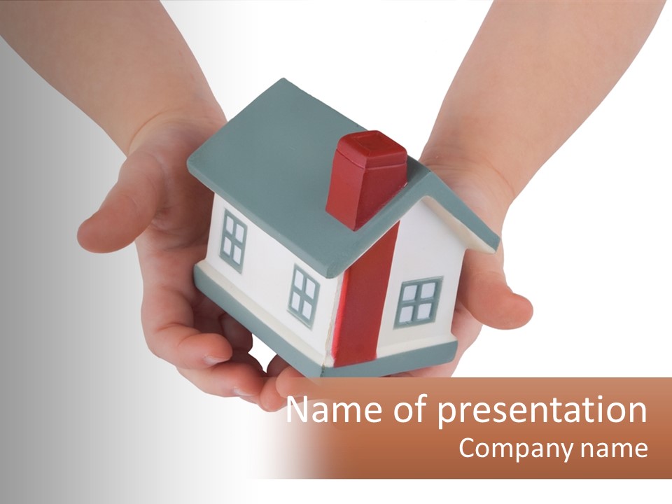 A Person Holding A Toy House In Their Hands PowerPoint Template