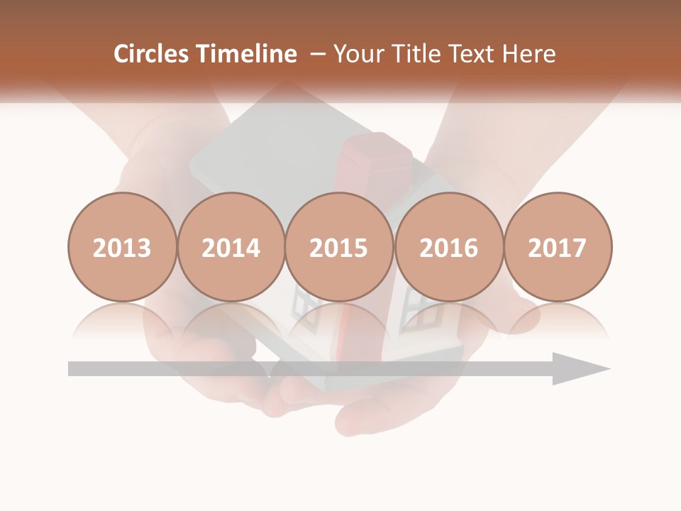 A Person Holding A Toy House In Their Hands PowerPoint Template