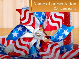 A Red, White, And Blue Pinwheel On A Table PowerPoint Template