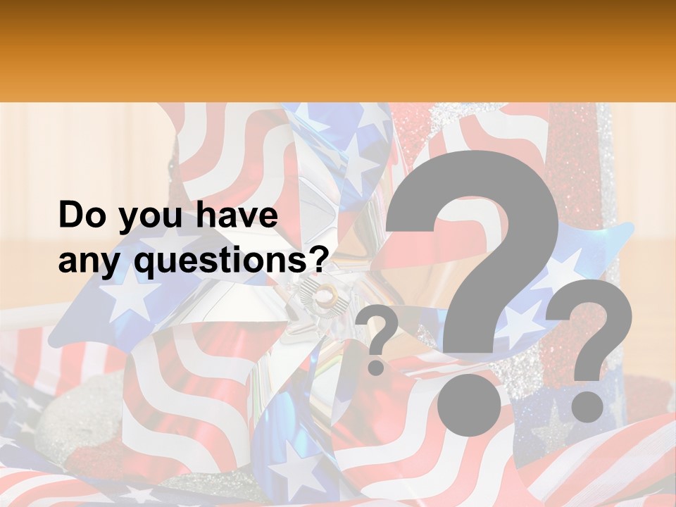 A Red, White, And Blue Pinwheel On A Table PowerPoint Template