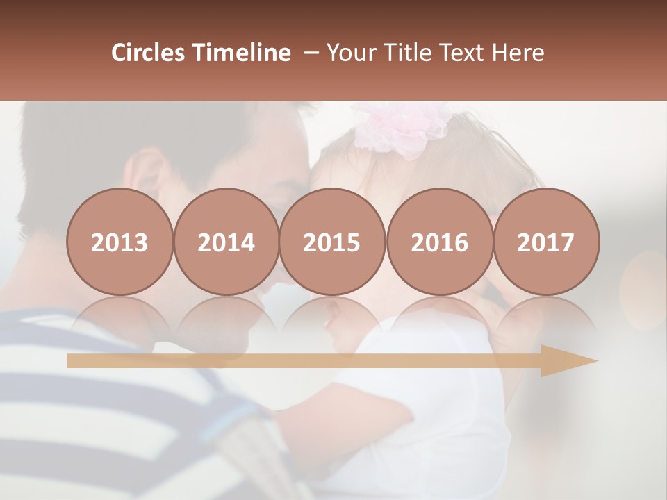 A Man Holding A Baby And Smiling At The Camera PowerPoint Template